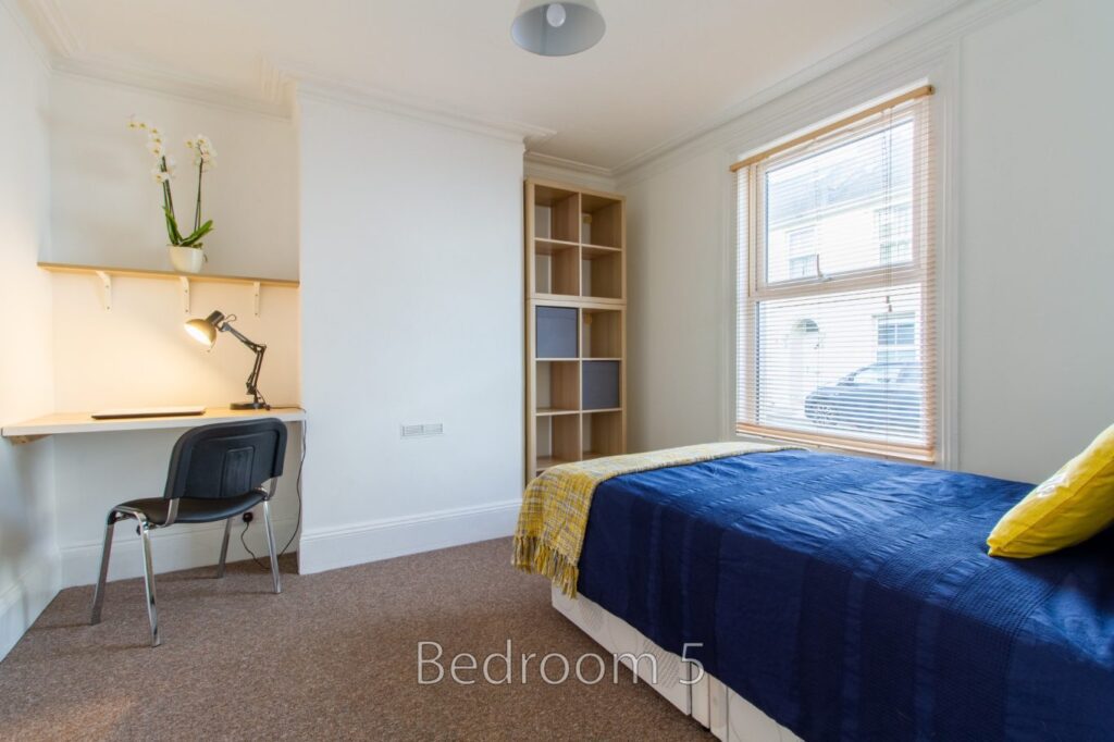 Bedroom 5 with a cozy bed at 24 Granville Street.