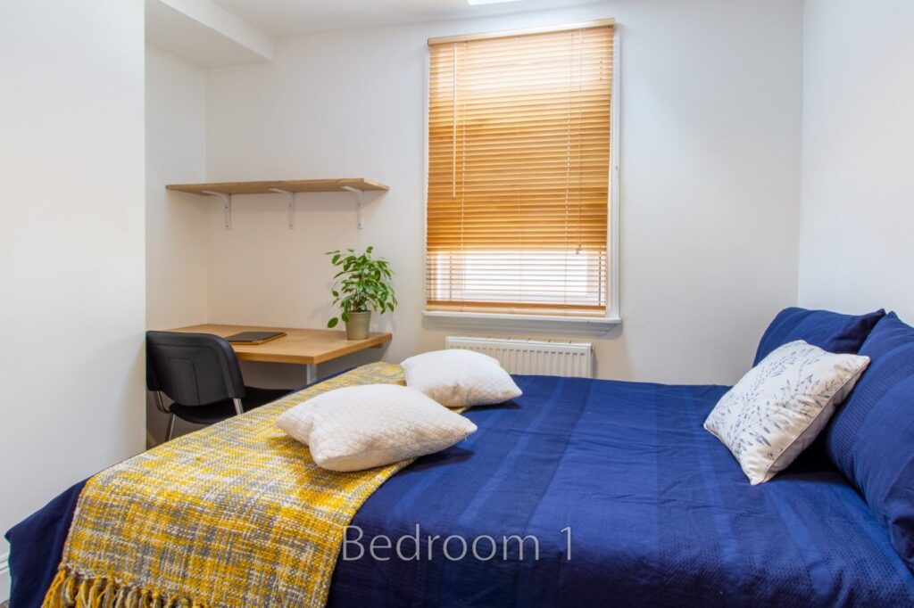 Cozy double bedroom and study desk setup in a 3-bed Cheltenham student house at 5 St Pauls Lane.