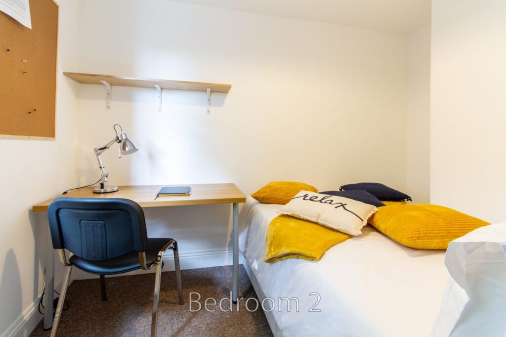 Study desk and bed in Bedroom 2 at 5 St Pauls Lane, Cheltenham.